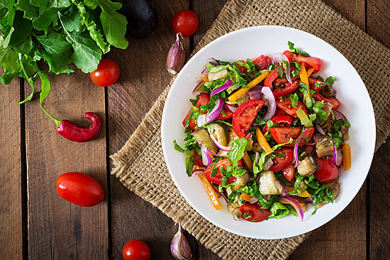 Colorful salad with fresh vegetables, perfect for a healthy summer meal.