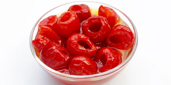 Vibrant maraschino cherries in syrup, perfect for desserts and festive occasions.