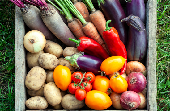 Colorful fresh vegetables in a rustic crate, celebrating natures bounty for healthy meals.